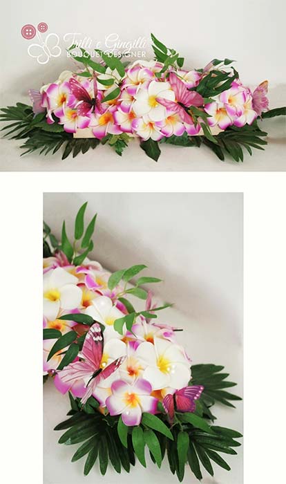 Centrotavola con frangipani e farfalle coordinato al bouquet sposa